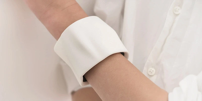Creatures bracelet series showing a white leather sculptural cuff for mass customization